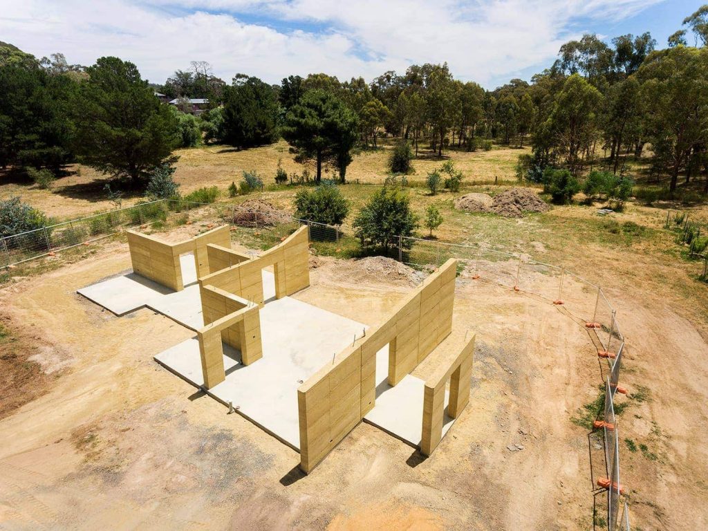 design of home with internal and external rammed earth walls 