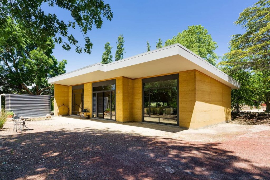 External north view of a rammed earth home
