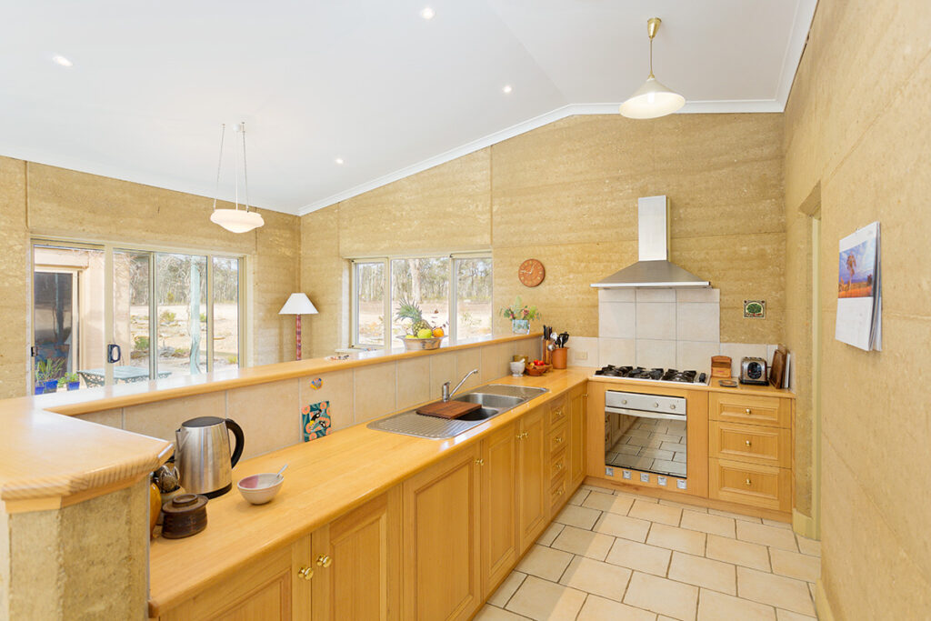 internal-rammed-earth-wood-kitchen