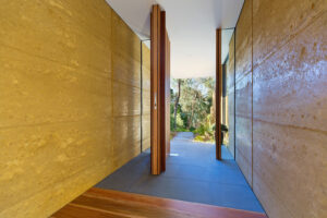 internal-rammed-earth-pivot-door