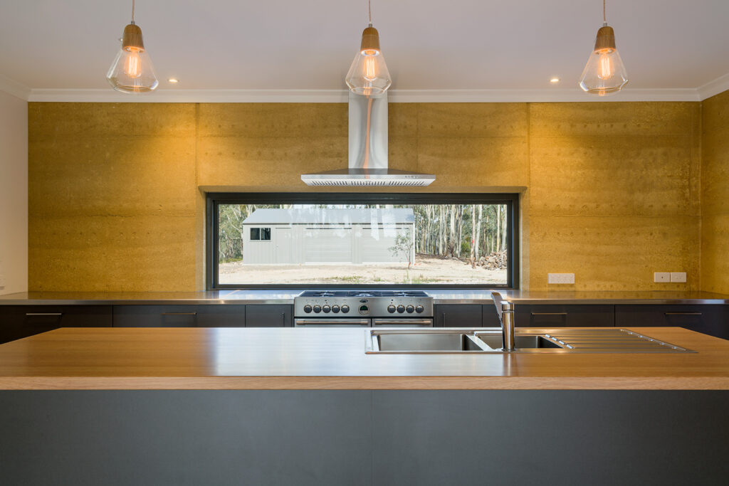 internal-rammed-earth-kitchen-feature