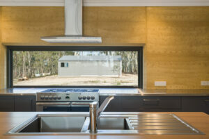 internal-rammed-earth-kitchen-feature-wall