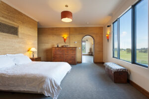 internal-rammed-earth-bedroom-feature-art